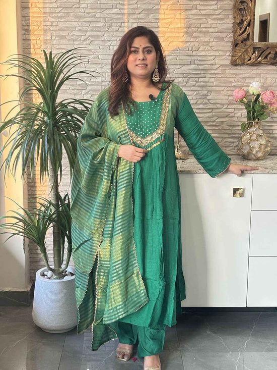 premium-banaras-mul-chanderi-a-line-hand-embroidered-suit-set-with-brocade-patches-paired-with-tissue-dupatta-green-1
