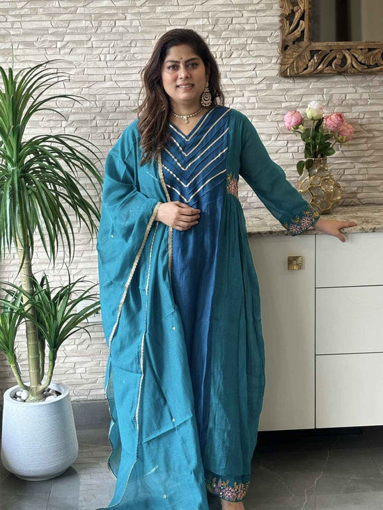 premium-banaras-mul-chanderi-hand-embroidered-a-line-suit-set-with-side-gathers-embroidered-malai-cotton-pant-mul-chanderi-dupatta-bluish-green-1